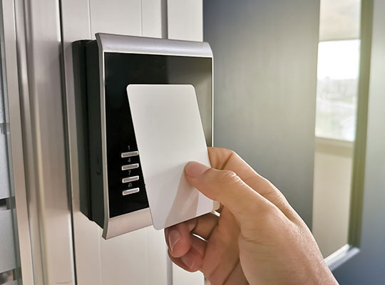 Hand using Key card;access control concept